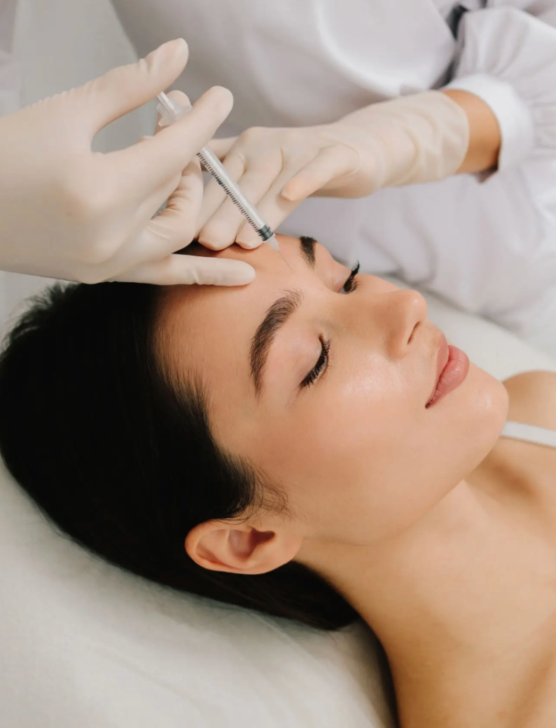 Woman receiving a facial cosmetic injection.